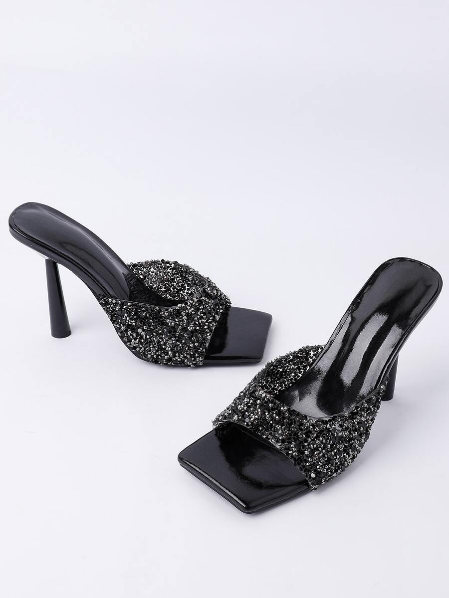 Women's slip-on high heel sandals featuring sparkling rhinestones, an open square toe, and a stiletto heel.
