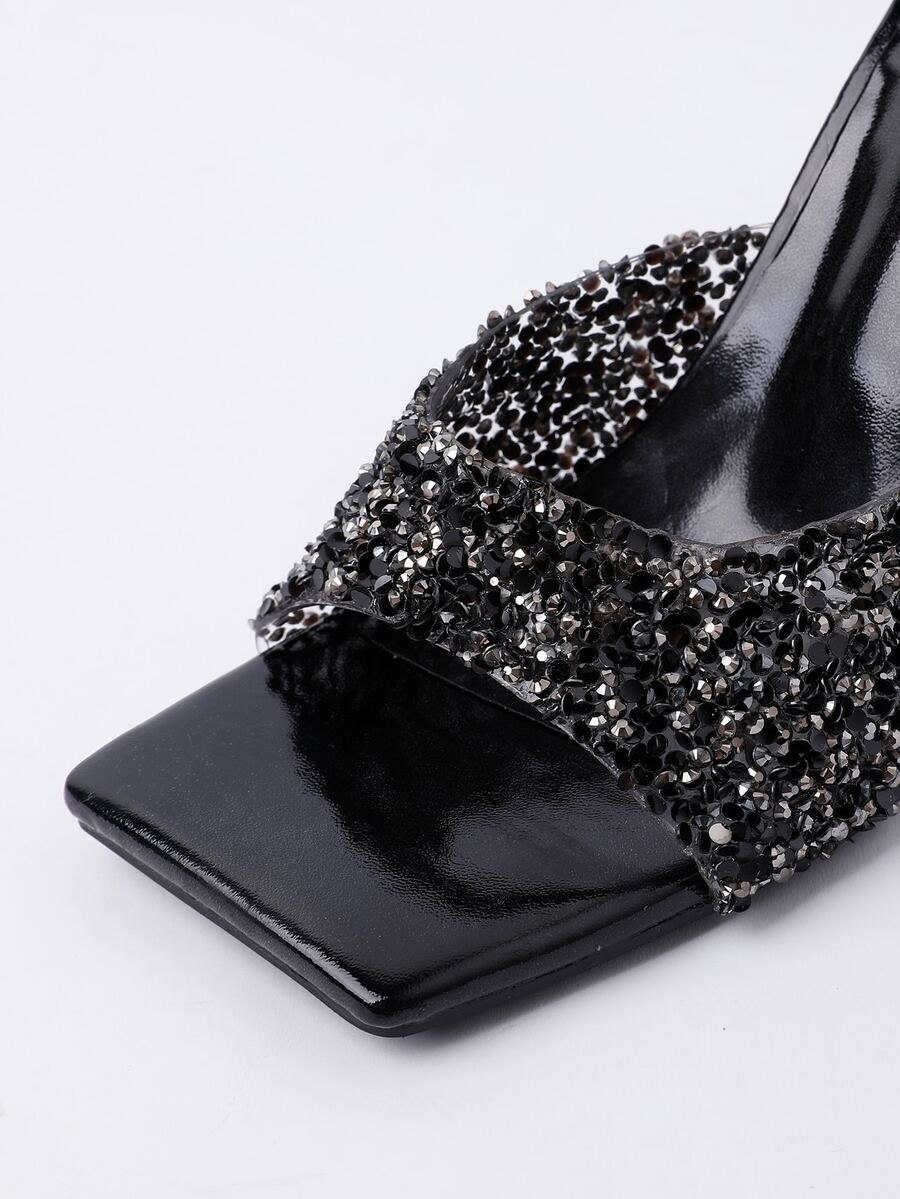 Women's slip-on high heel sandals featuring sparkling rhinestones, an open square toe, and a stiletto heel.