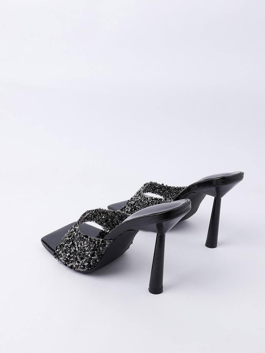 Women's slip-on high heel sandals featuring sparkling rhinestones, an open square toe, and a stiletto heel.
