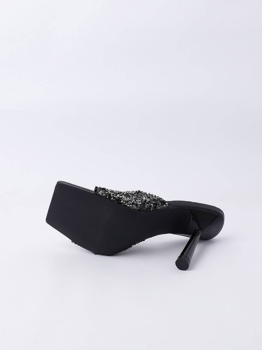 Women's slip-on high heel sandals featuring sparkling rhinestones, an open square toe, and a stiletto heel.