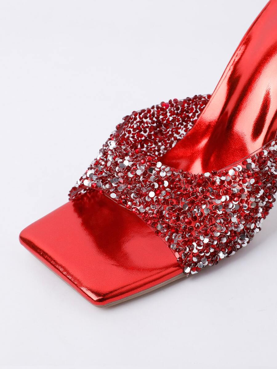 Women's slip-on high heel sandals featuring sparkling rhinestones, an open square toe, and a stiletto heel.