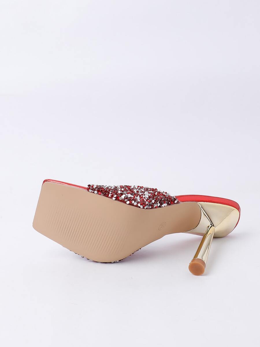 Women's slip-on high heel sandals featuring sparkling rhinestones, an open square toe, and a stiletto heel.