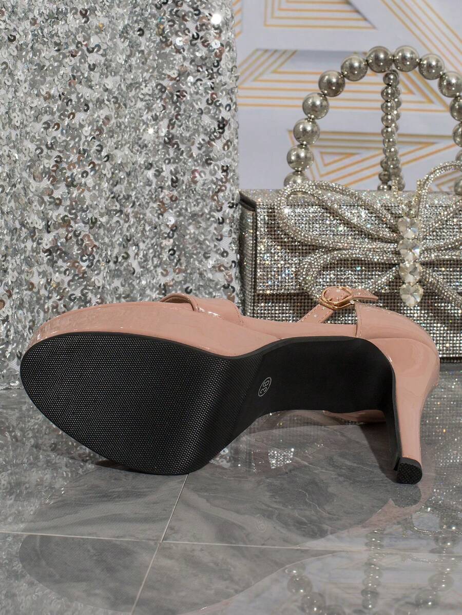 Women's open-toe platform stiletto heeled sandals featuring an ankle strap with rhinestone buckle detail.