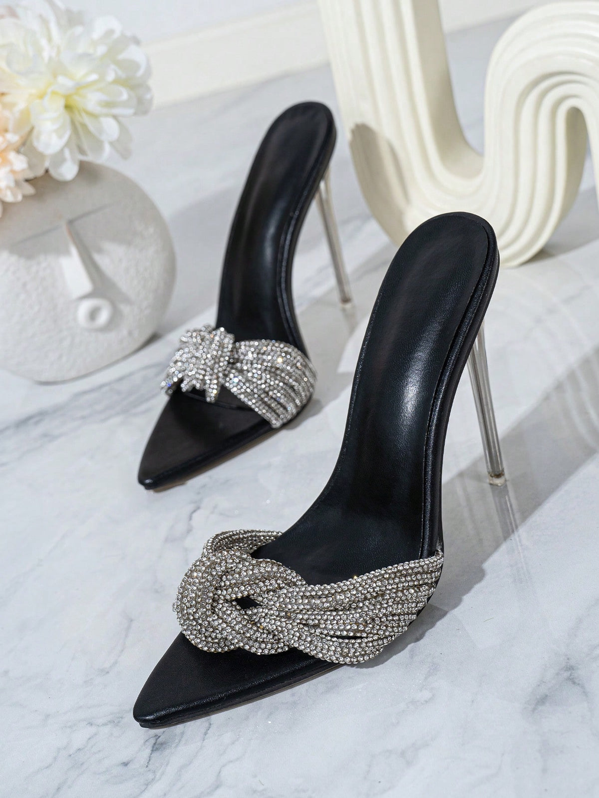 Silver high heel sandals featuring open toe design, stiletto heel, sparkling rhinestone details, and wrap-around tie-up ankle straps.