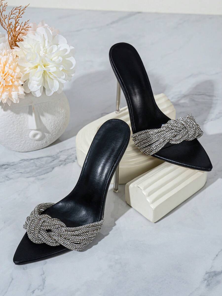 Silver high heel sandals featuring open toe design, stiletto heel, sparkling rhinestone details, and wrap-around tie-up ankle straps.