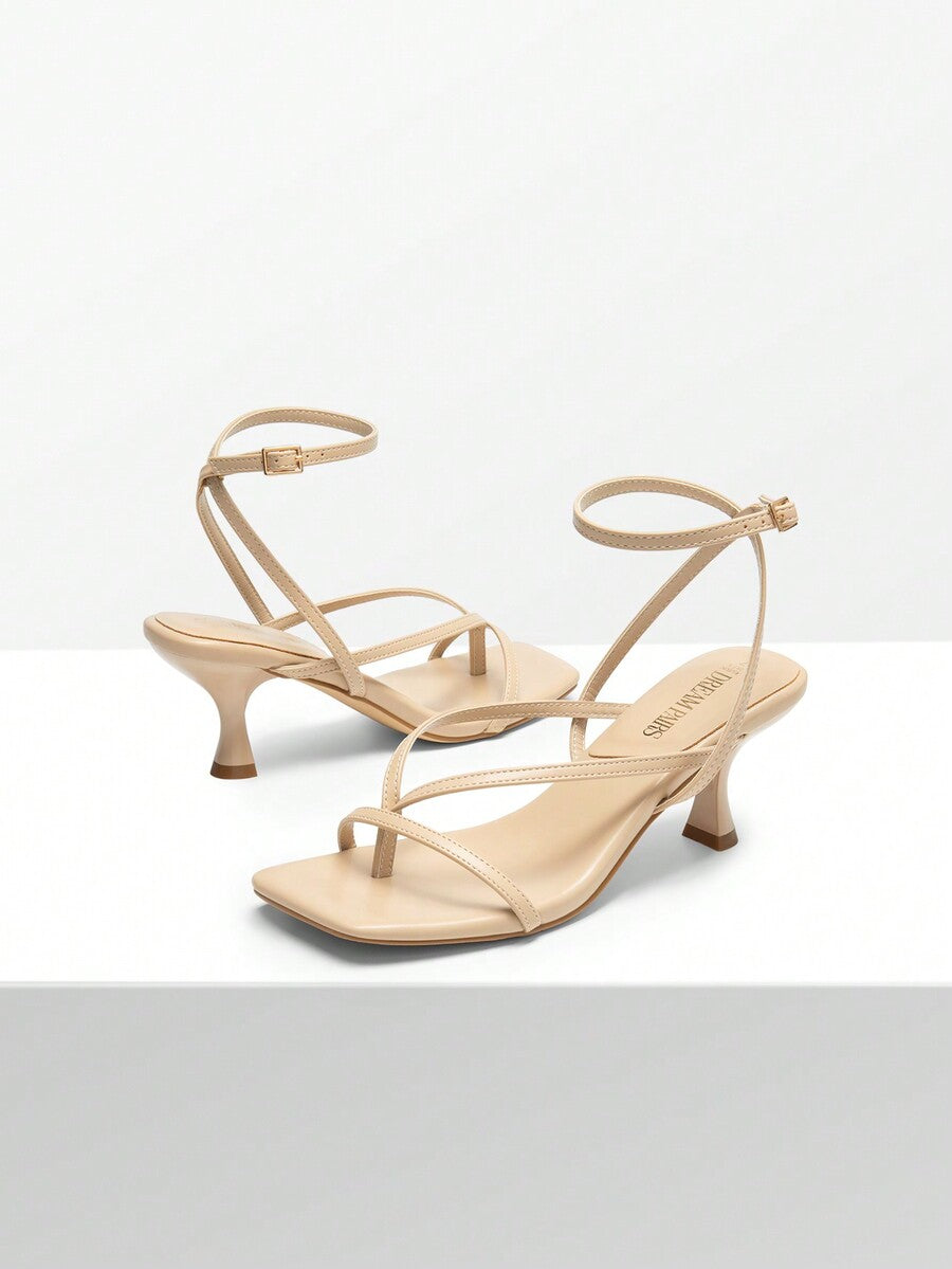 Pair of women's minimalist square toe kitten heeled thong sandals featuring slim ankle straps with buckle closure and sleek low heels.