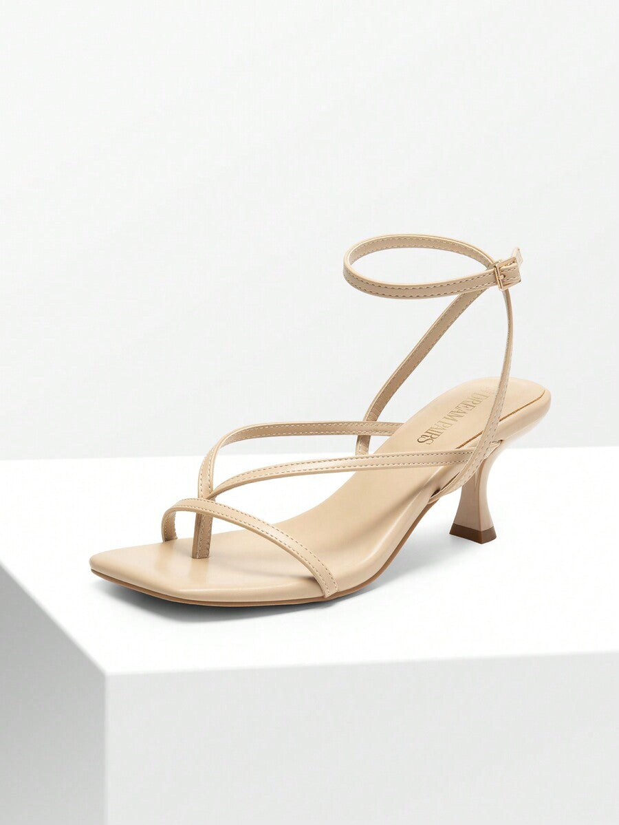 Pair of women's minimalist square toe kitten heeled thong sandals featuring slim ankle straps with buckle closure and sleek low heels.