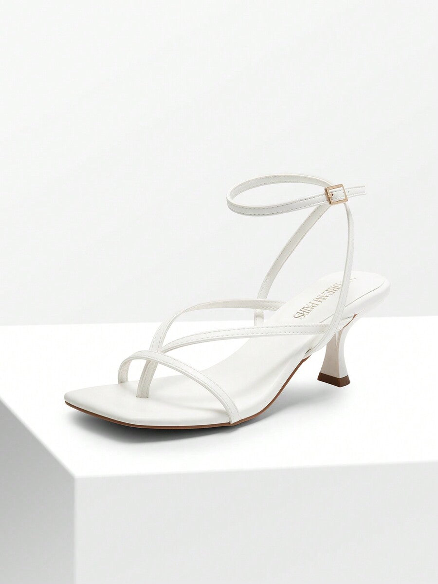 Pair of women's minimalist square toe kitten heeled thong sandals featuring slim ankle straps with buckle closure and sleek low heels.
