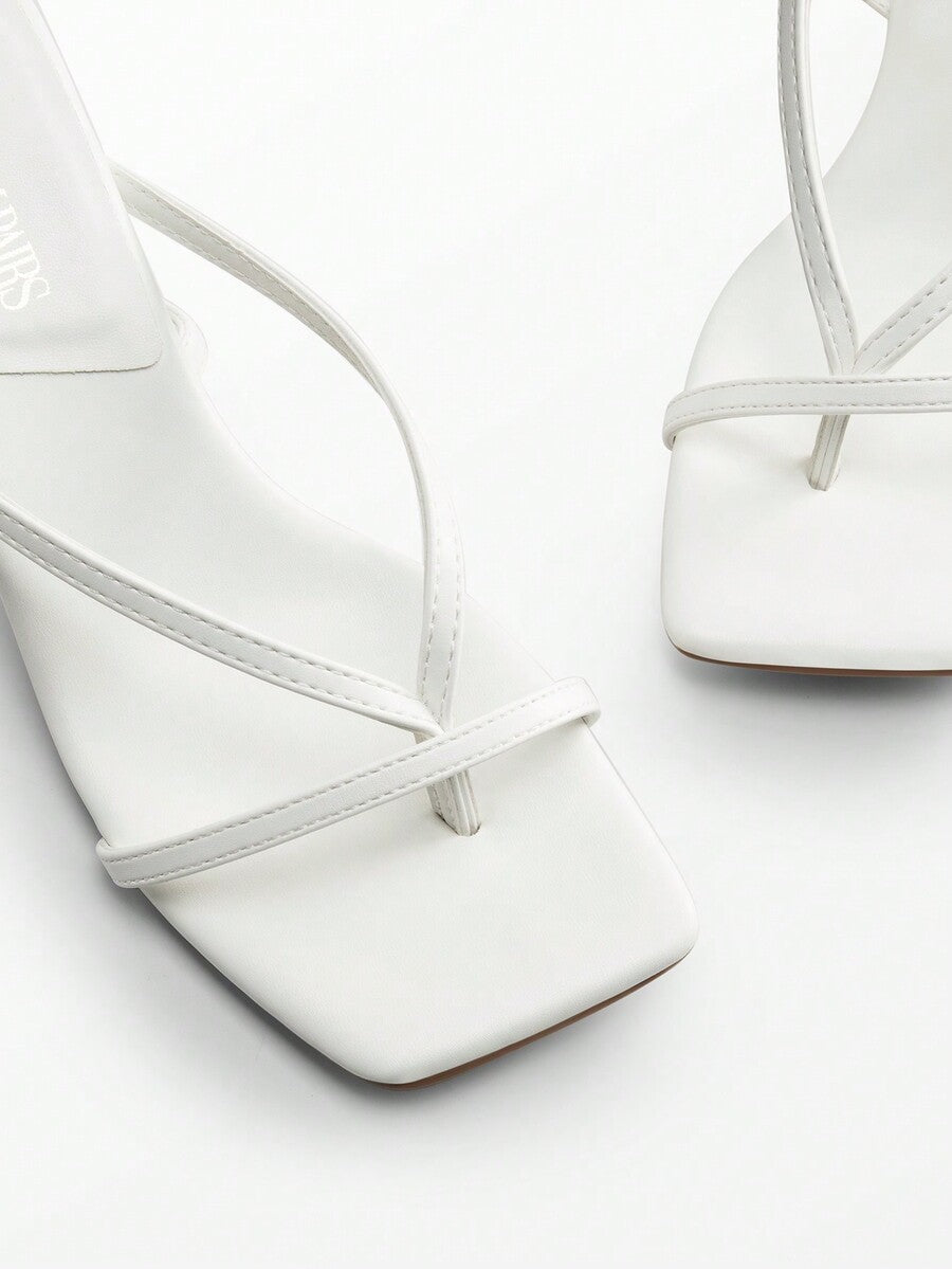 Pair of women's minimalist square toe kitten heeled thong sandals featuring slim ankle straps with buckle closure and sleek low heels.