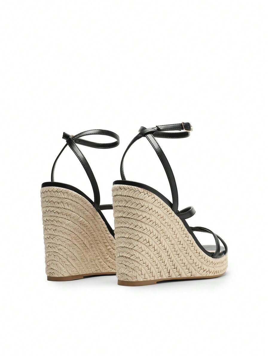 Women's strappy espadrille platform wedge sandals featuring an open toe design and adjustable ankle buckle strap