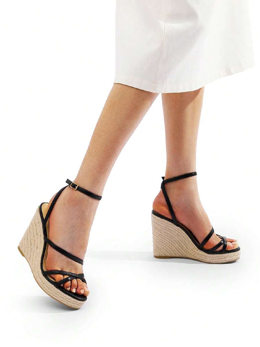 Women's strappy espadrille platform wedge sandals featuring an open toe design and adjustable ankle buckle strap