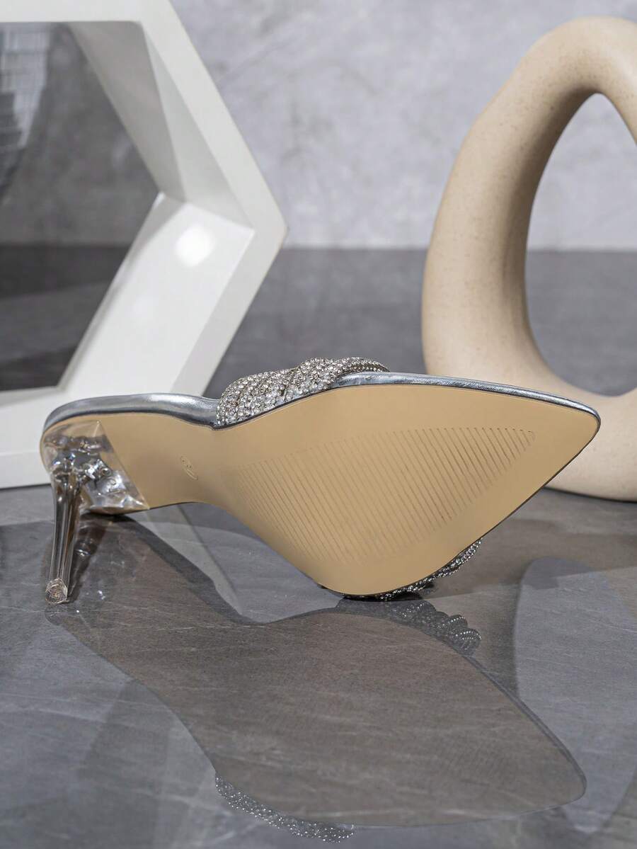 Silver high heel sandals featuring open toe design, stiletto heel, sparkling rhinestone details, and wrap-around tie-up ankle straps.