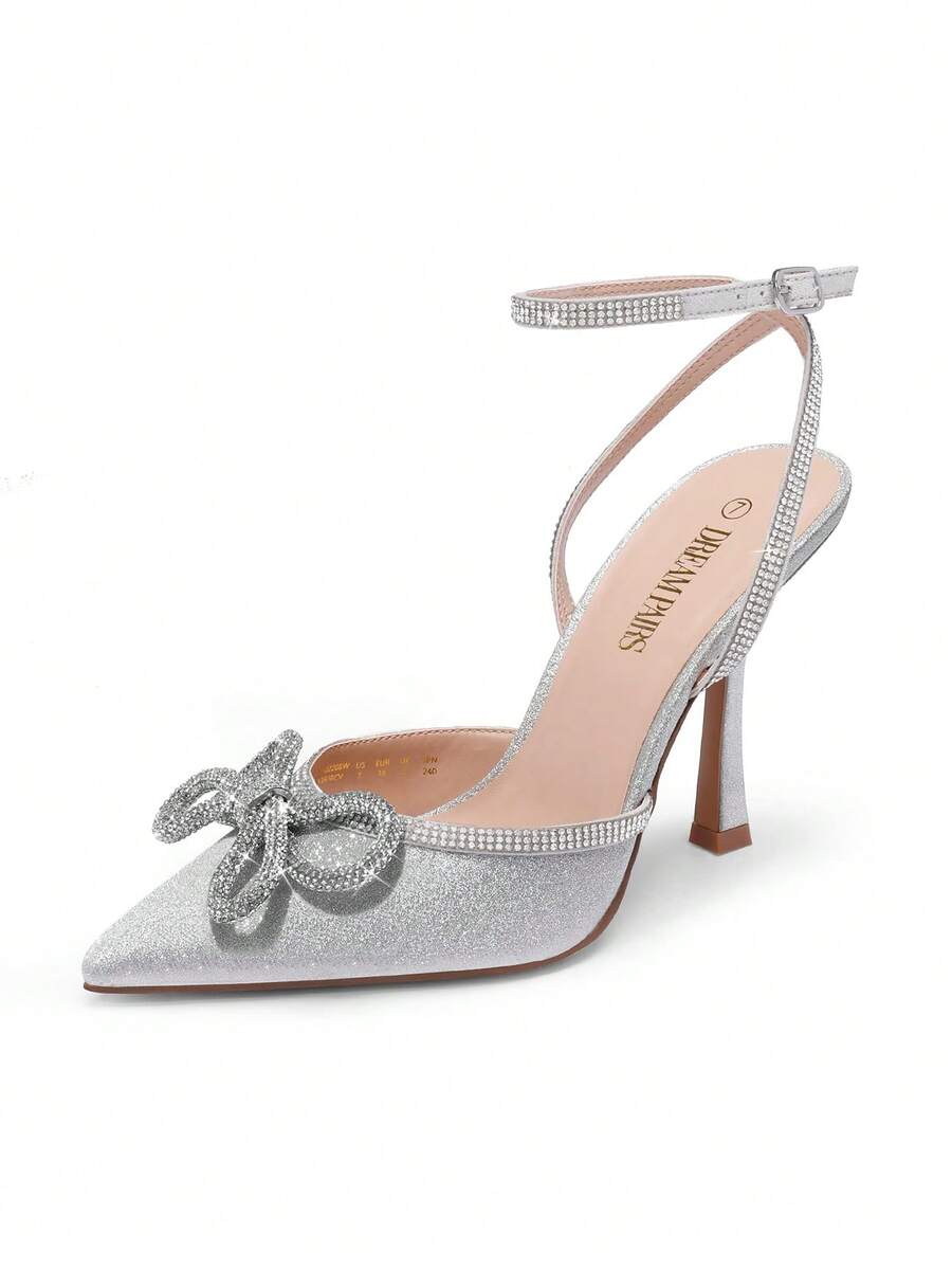 Women's rhinestone ankle strap high heels with pointed closed toe, strappy bow details, and stiletto heel for wedding and prom wear.