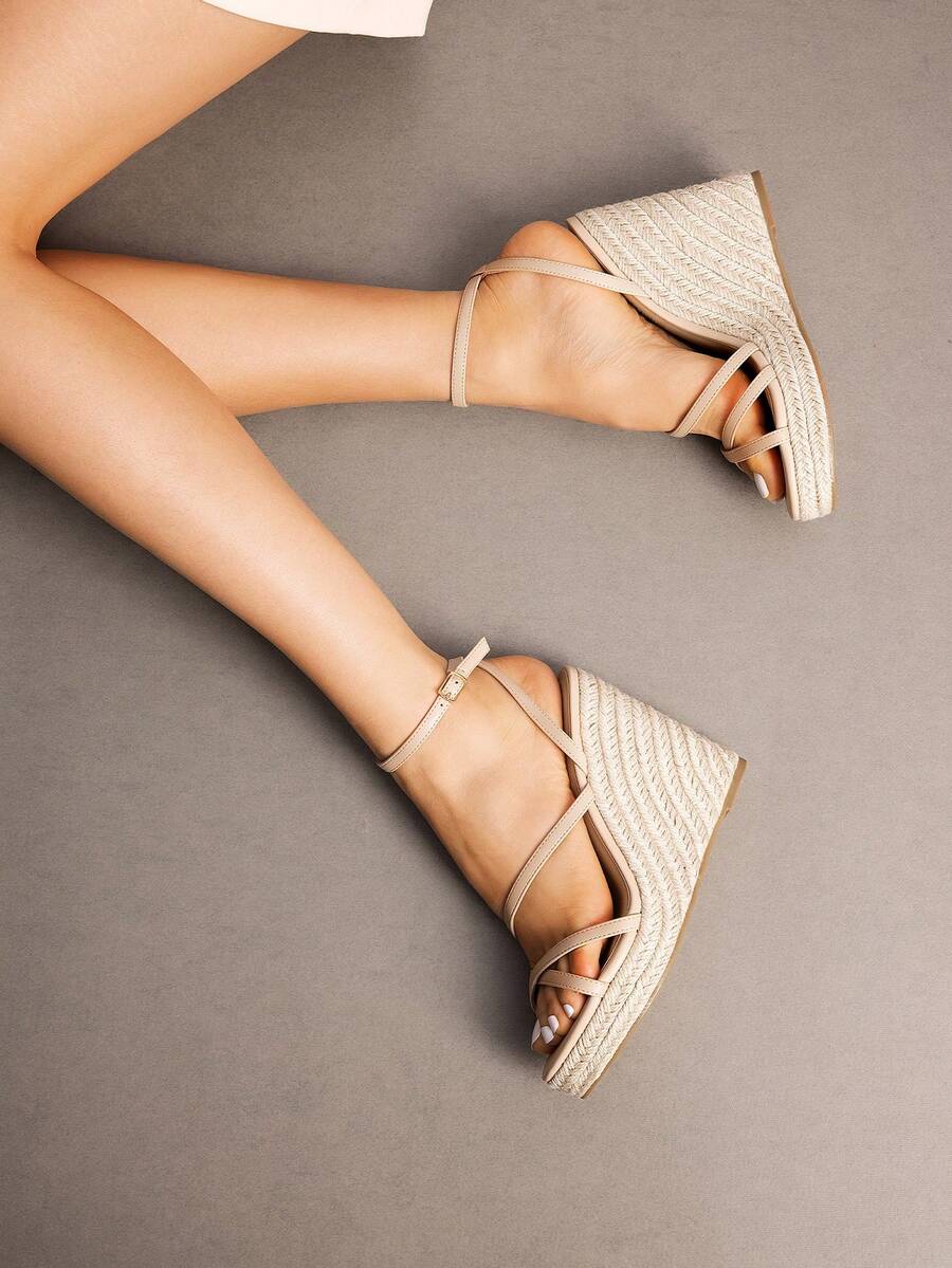 Women's strappy espadrille platform wedge sandals featuring an open toe design and adjustable ankle buckle strap