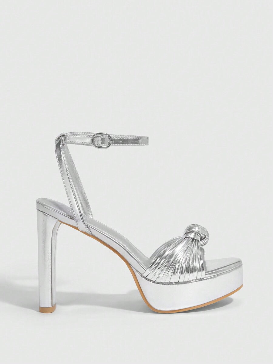 Women's platform block heel sandals featuring an open toe design and an adjustable ankle strap buckle closure.