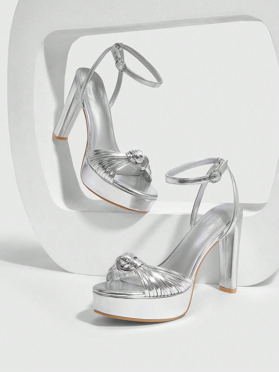 Women's platform block heel sandals featuring an open toe design and an adjustable ankle strap buckle closure.