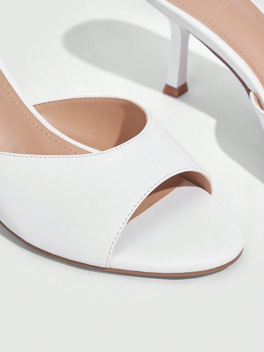 Pair of women's open toe high heel slingback sandals made with smooth PU leather