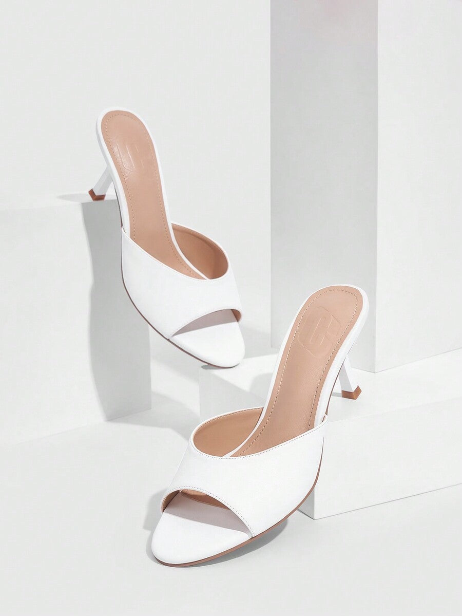 Pair of women's open toe high heel slingback sandals made with smooth PU leather