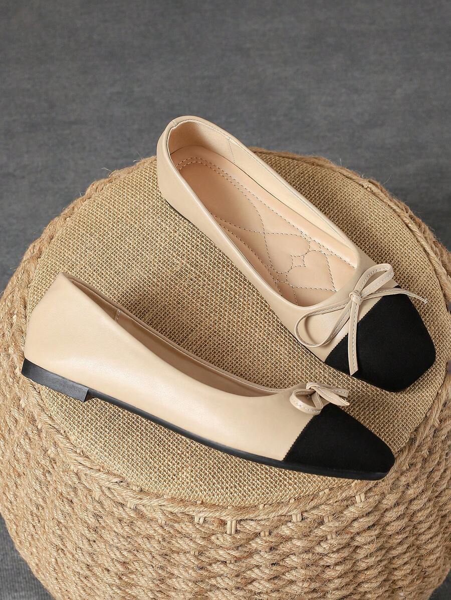 Pair of women's square toe slip-on flat shoes featuring a delicate bow detail and low vamp design.