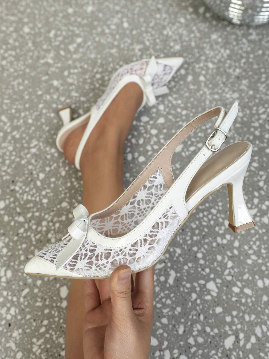 Pointed toe stiletto high heels featuring white mesh lace upper, bowknot accent, and slingback buckle strap.