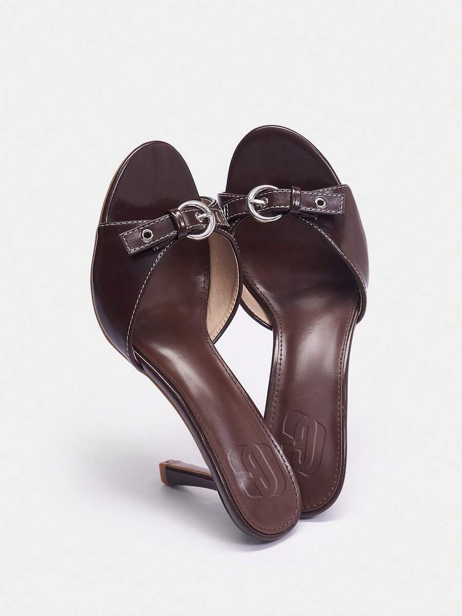 Women's open toe high heel slingback sandals featuring a stiletto heel, buckle strap with grommet eyelets, and smooth PU leather finish.