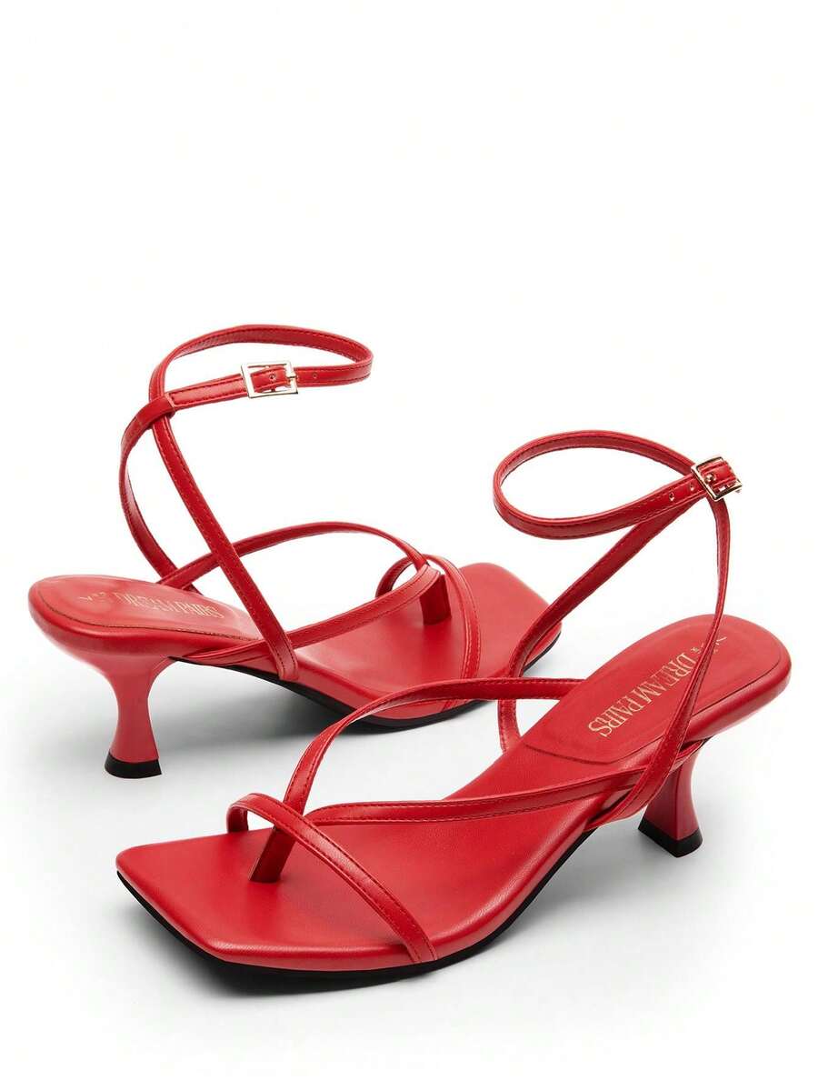 Pair of women's minimalist square toe kitten heeled thong sandals featuring slim ankle straps with buckle closure and sleek low heels.