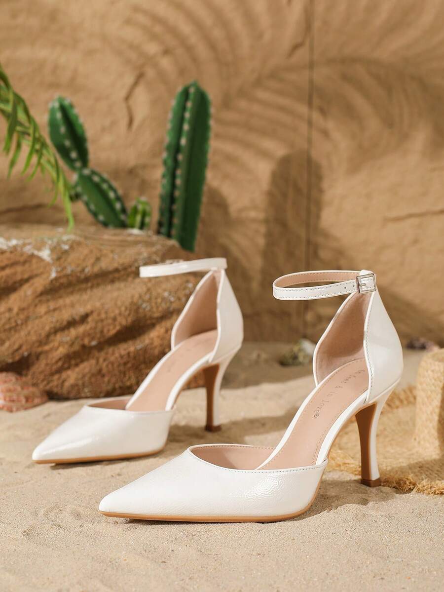 Elegant pointy-toe stiletto high heel pumps with hollow out sides and buckle ankle strap for weddings and evening dresses.