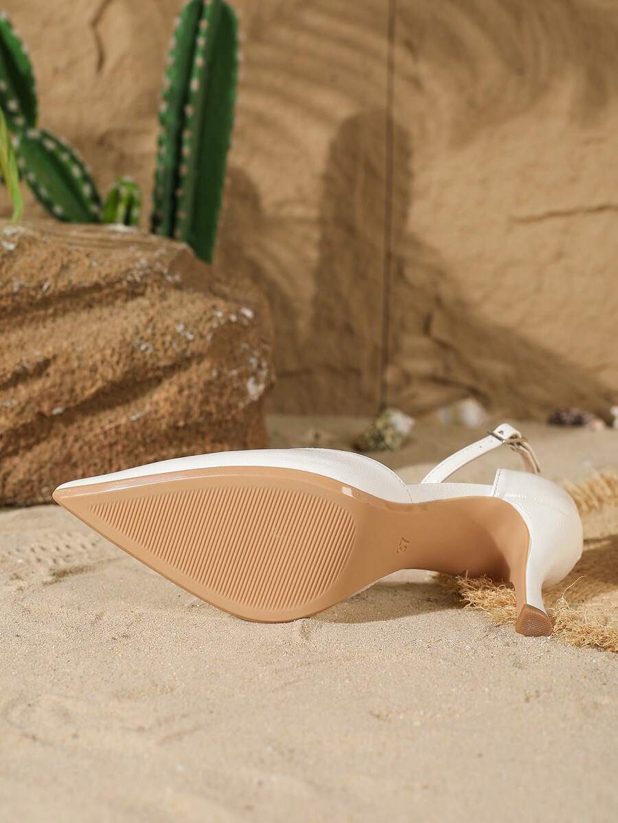 Elegant pointy-toe stiletto high heel pumps with hollow out sides and buckle ankle strap for weddings and evening dresses.