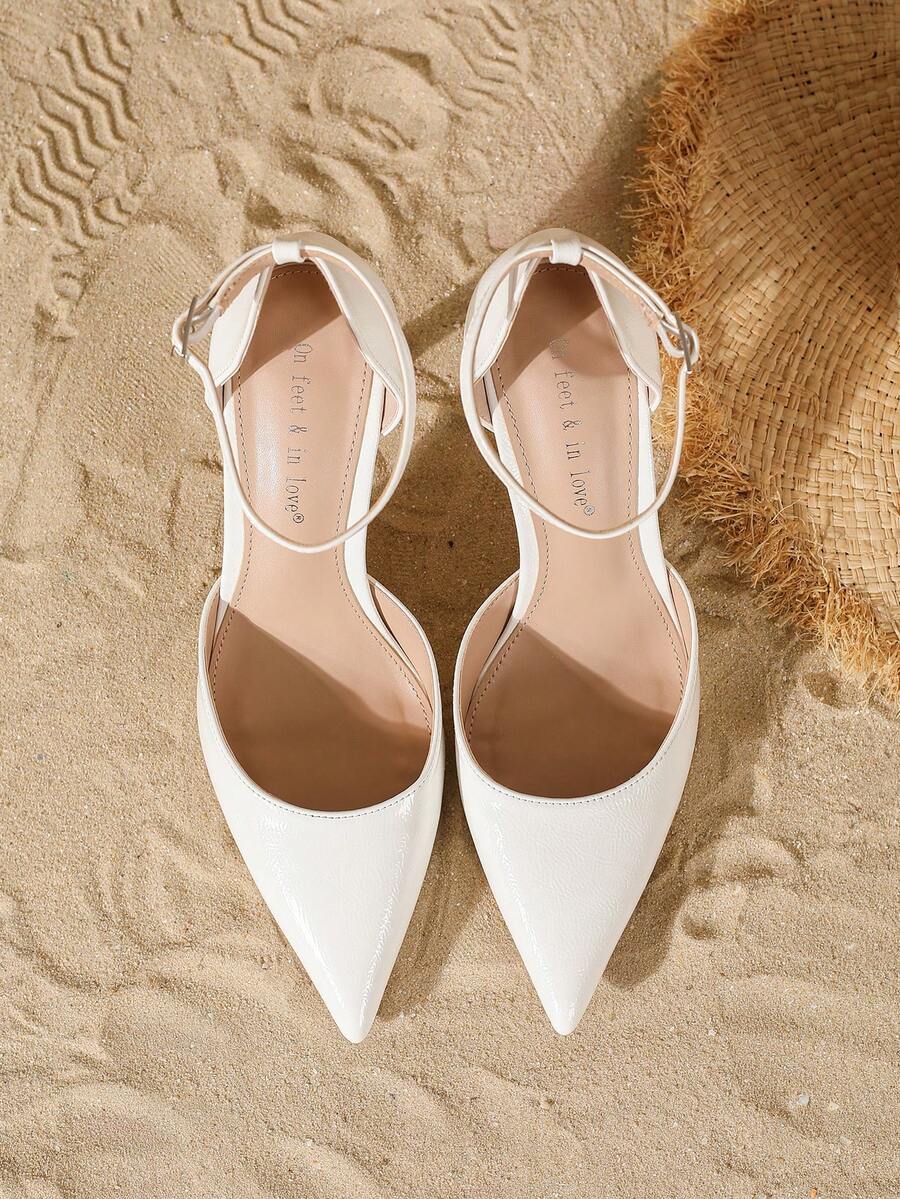 Elegant pointy-toe stiletto high heel pumps with hollow out sides and buckle ankle strap for weddings and evening dresses.