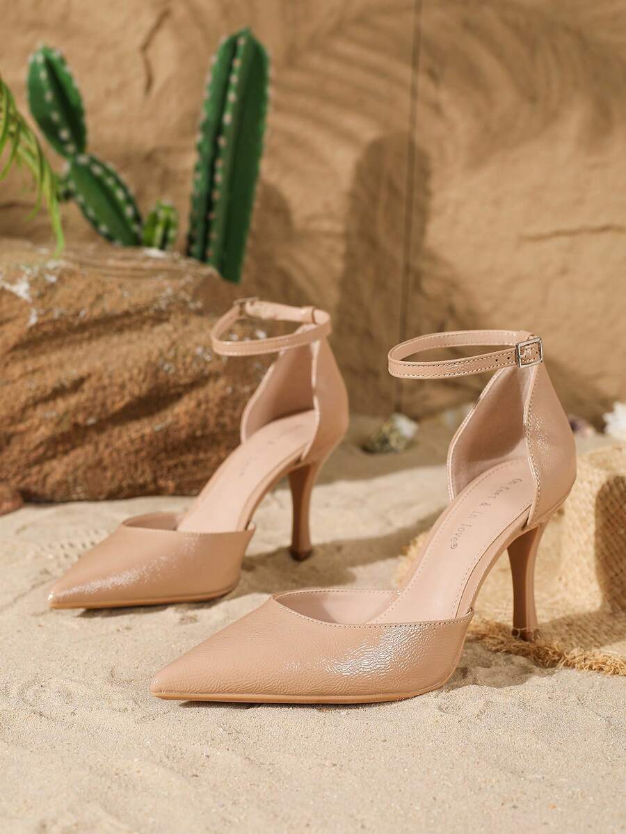 Elegant pointy-toe stiletto high heel pumps with hollow out sides and buckle ankle strap for weddings and evening dresses.
