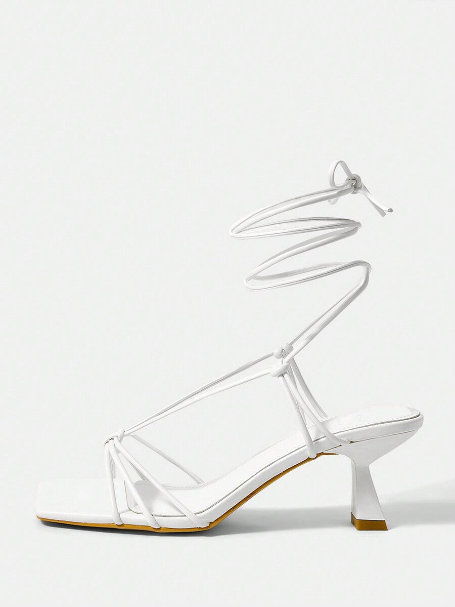 Women's square toe stiletto heel slingback sandals featuring sleek straps and buckle closure in a backless design.
