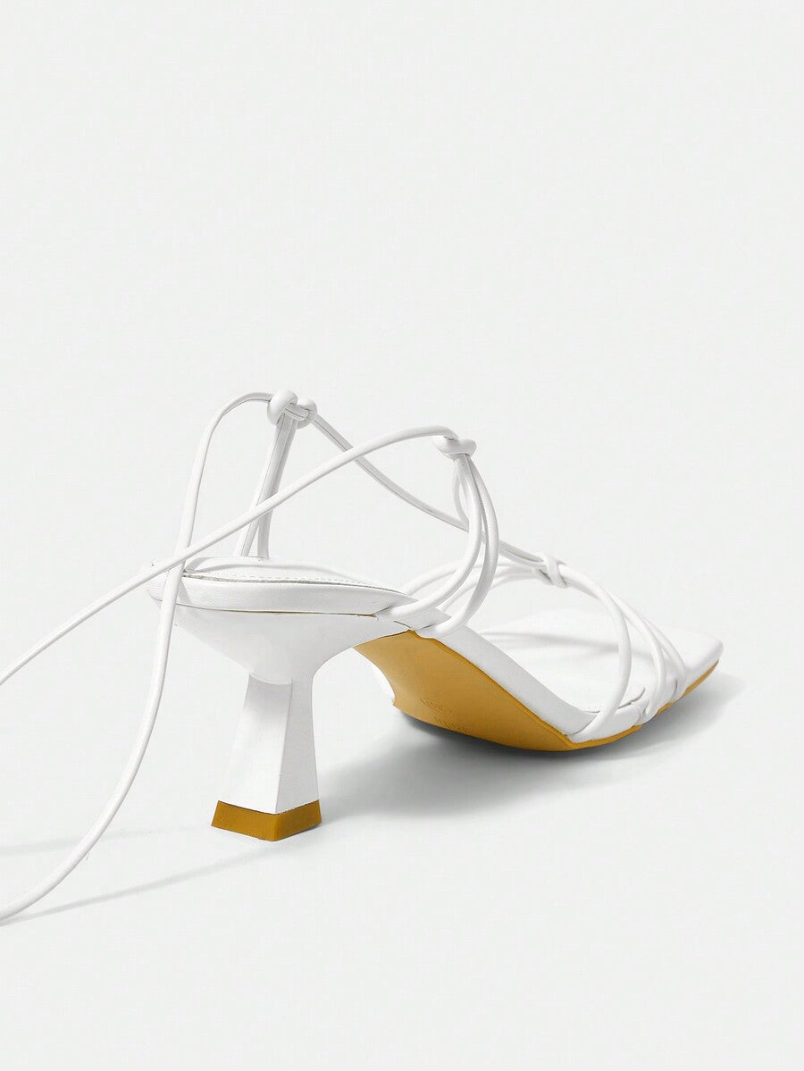 Women's square toe stiletto heel slingback sandals featuring sleek straps and buckle closure in a backless design.