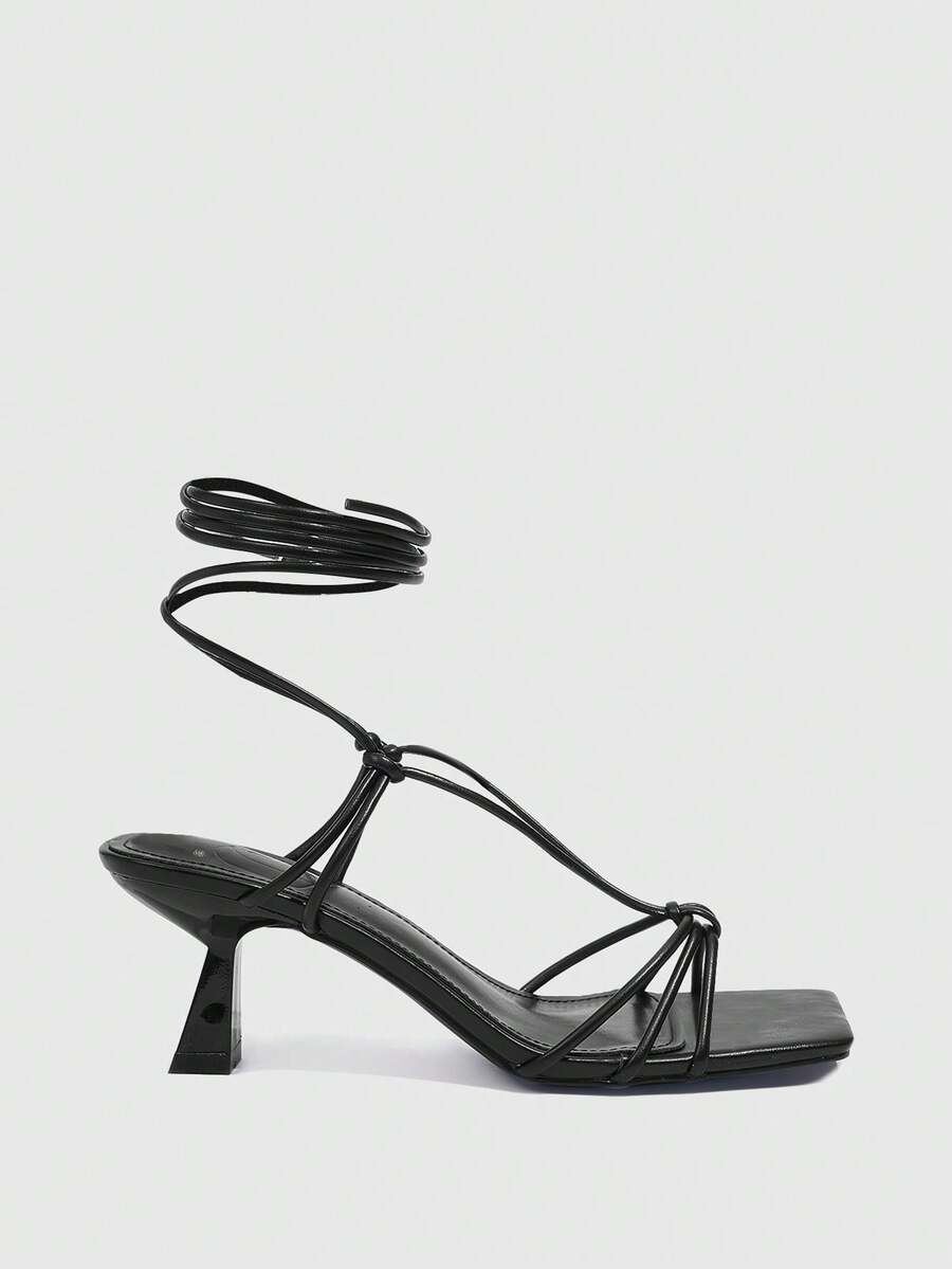 Women's square toe stiletto heel slingback sandals featuring sleek straps and buckle closure in a backless design.
