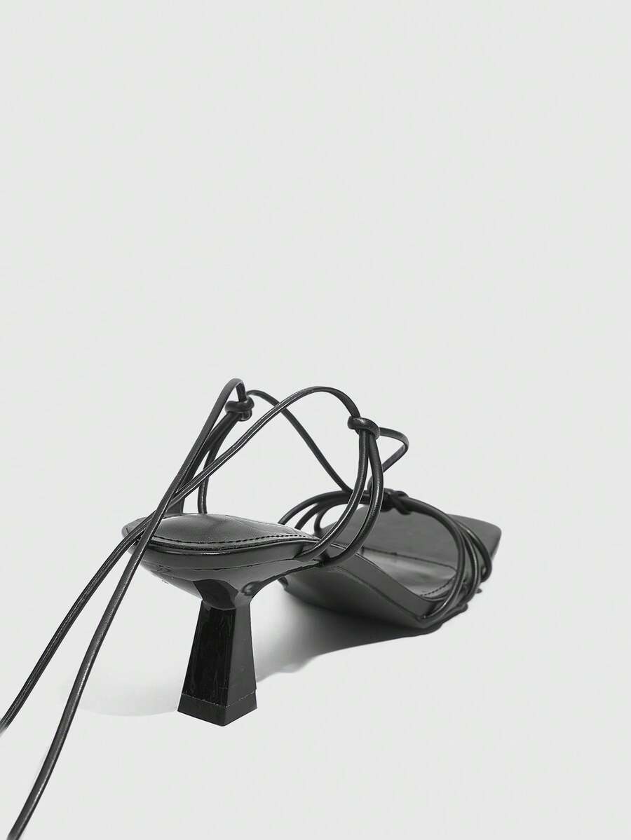 Women's square toe stiletto heel slingback sandals featuring sleek straps and buckle closure in a backless design.