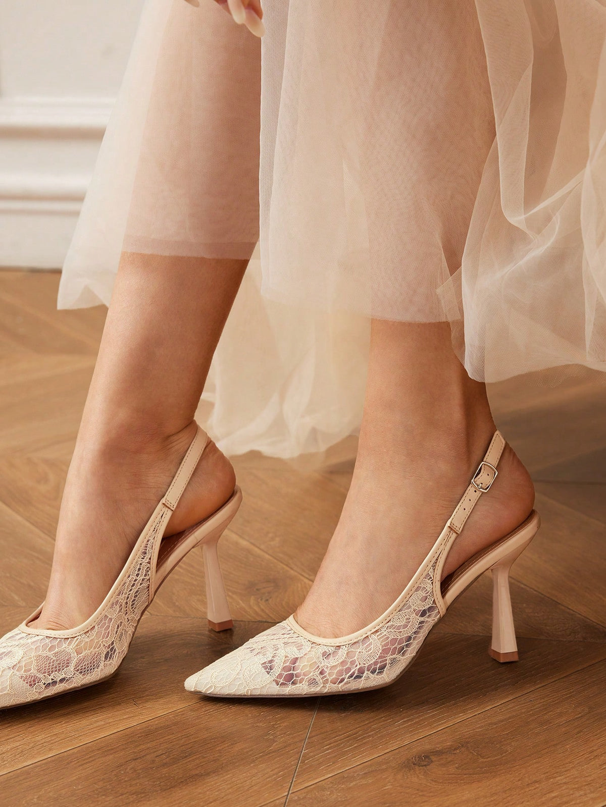 High heel wedding slingback pumps featuring delicate lace mesh upper, pointed toe, buckle strap, and stiletto heel