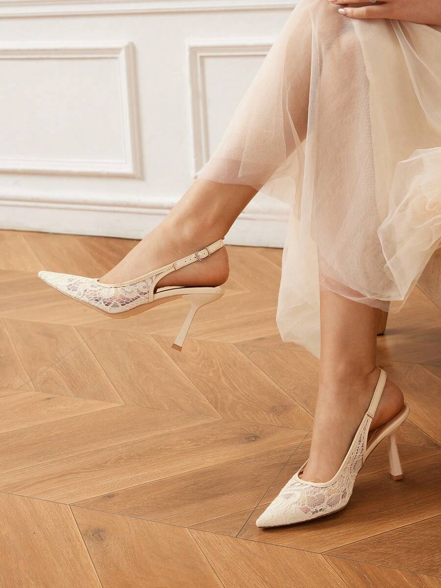 High heel wedding slingback pumps featuring delicate lace mesh upper, pointed toe, buckle strap, and stiletto heel