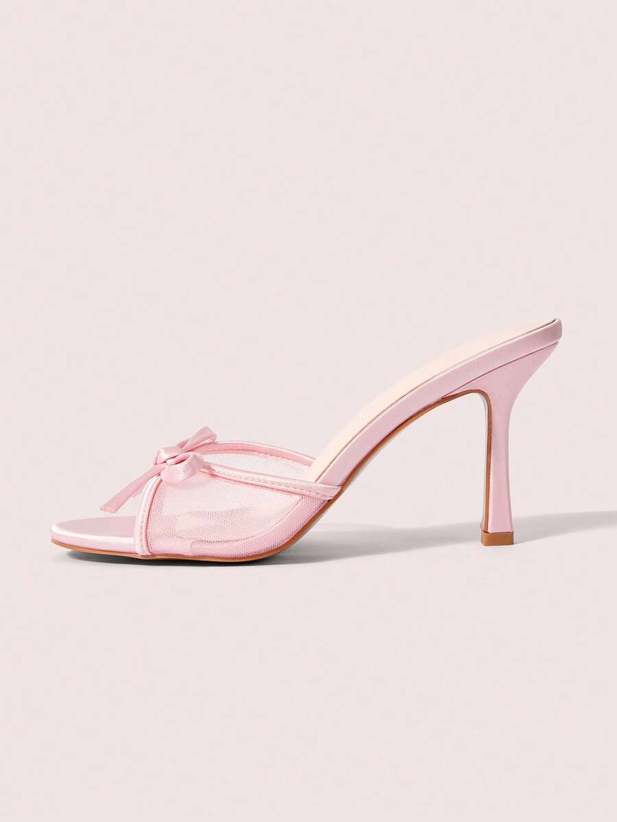 Pair of women's open toe stiletto heeled sandals crafted in satin with a bow accent
