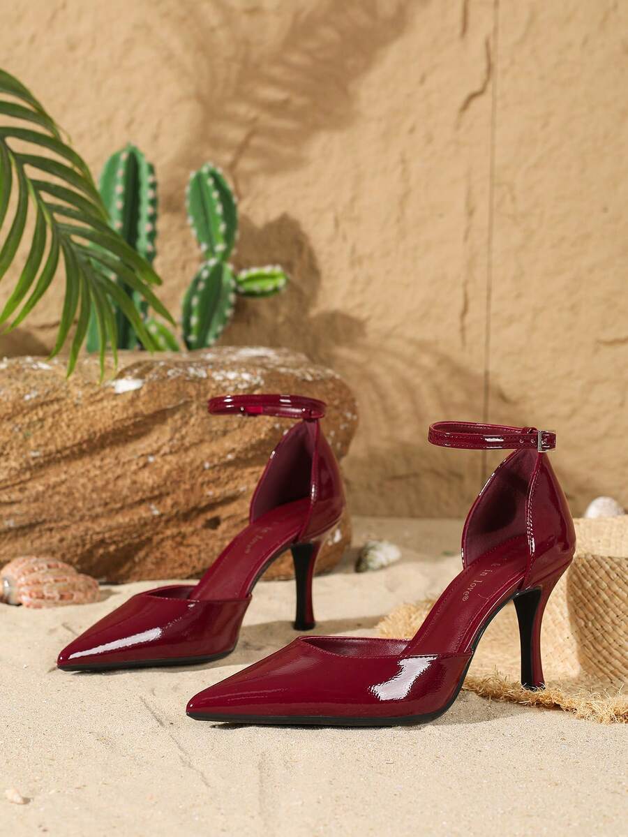 Elegant pointy-toe stiletto high heel pumps with hollow out sides and buckle ankle strap for weddings and evening dresses.