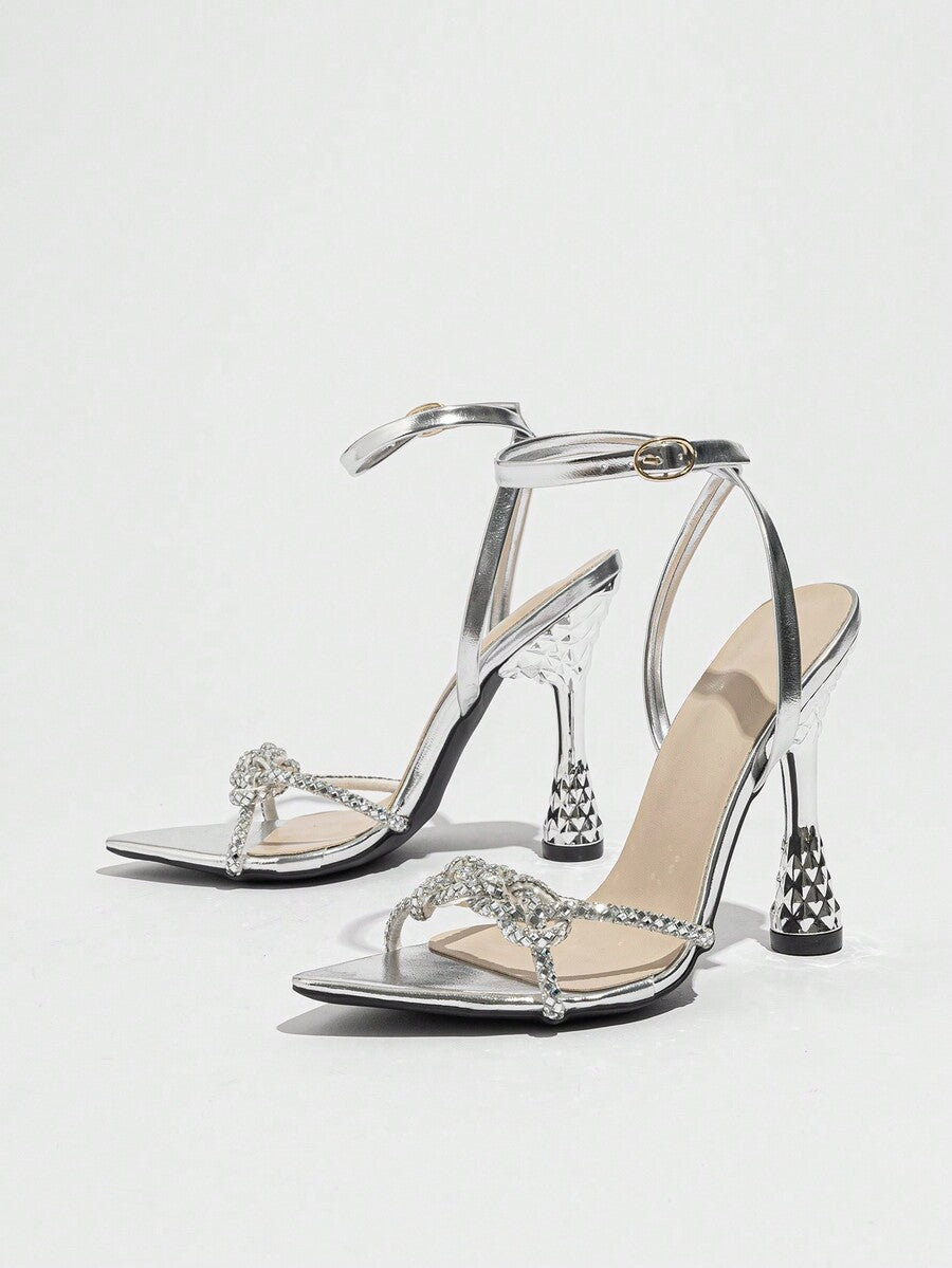 Women's peep toe stiletto high heel strappy sandals with rhinestone accents and slip-on design.