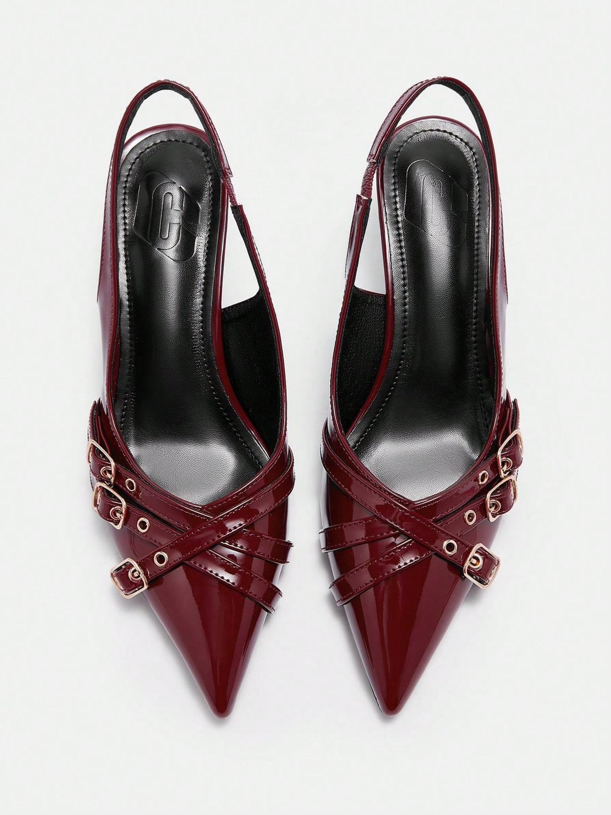 Pointed toe high heel backstrap sandals for women featuring criss cross straps with buckle detailing and a sleek stiletto heel.
