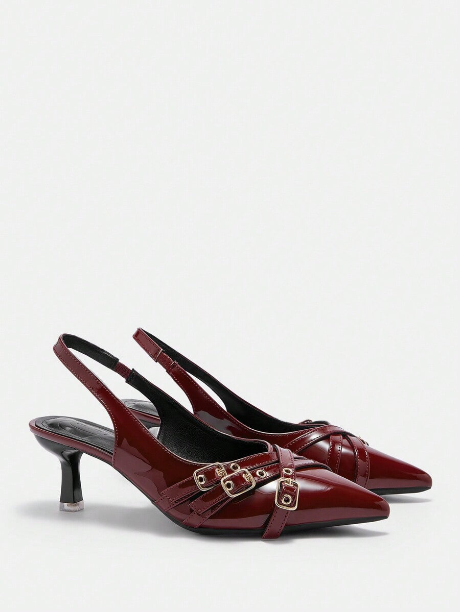 Pointed toe high heel backstrap sandals for women featuring criss cross straps with buckle detailing and a sleek stiletto heel.