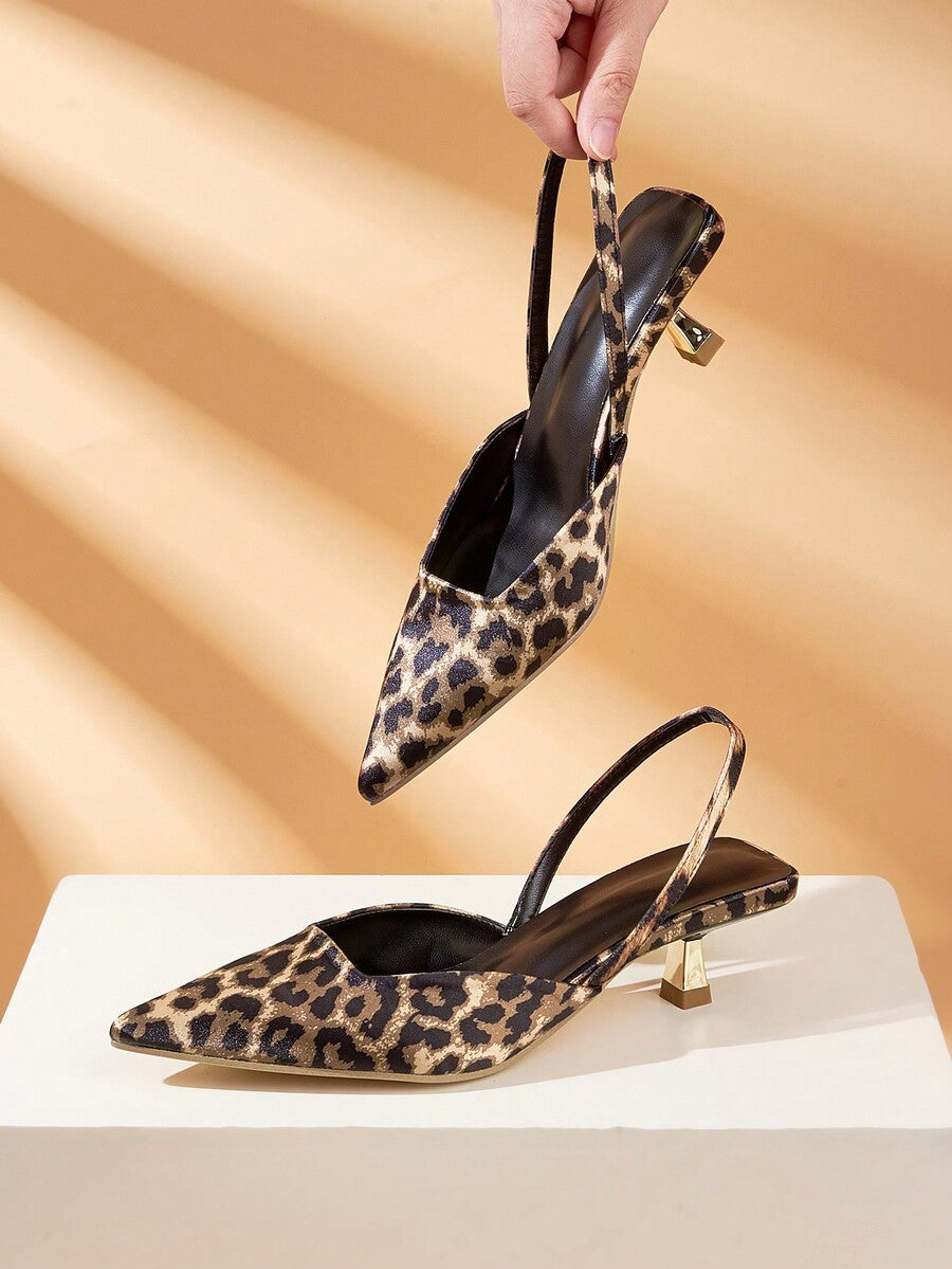 Women's pointed toe kitten heel pumps with leopard print suedette finish and slingback back strap.