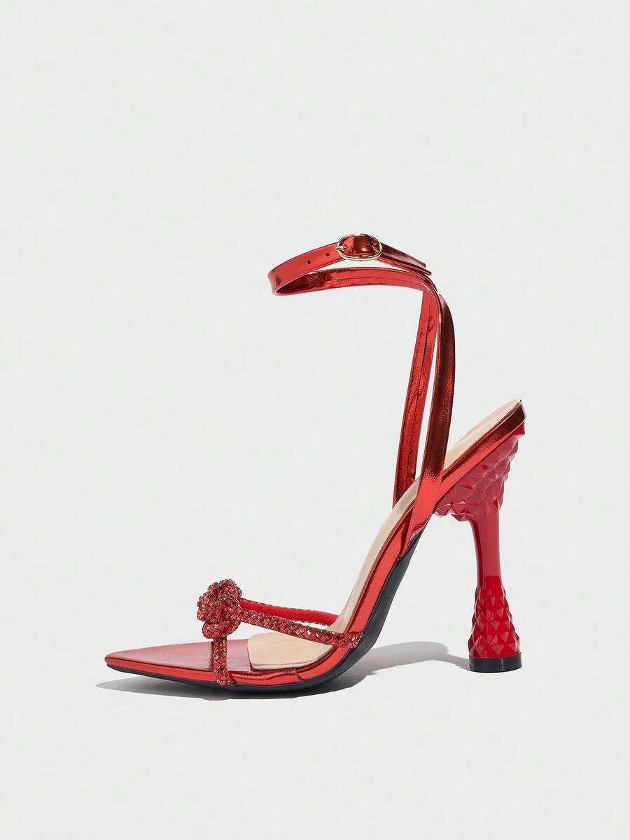 Women's peep toe stiletto high heel strappy sandals with rhinestone accents and slip-on design.