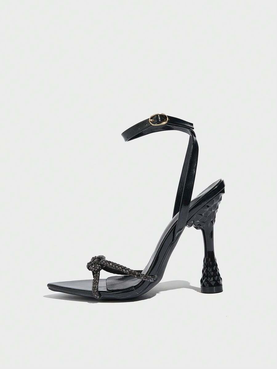 Women's peep toe stiletto high heel strappy sandals with rhinestone accents and slip-on design.