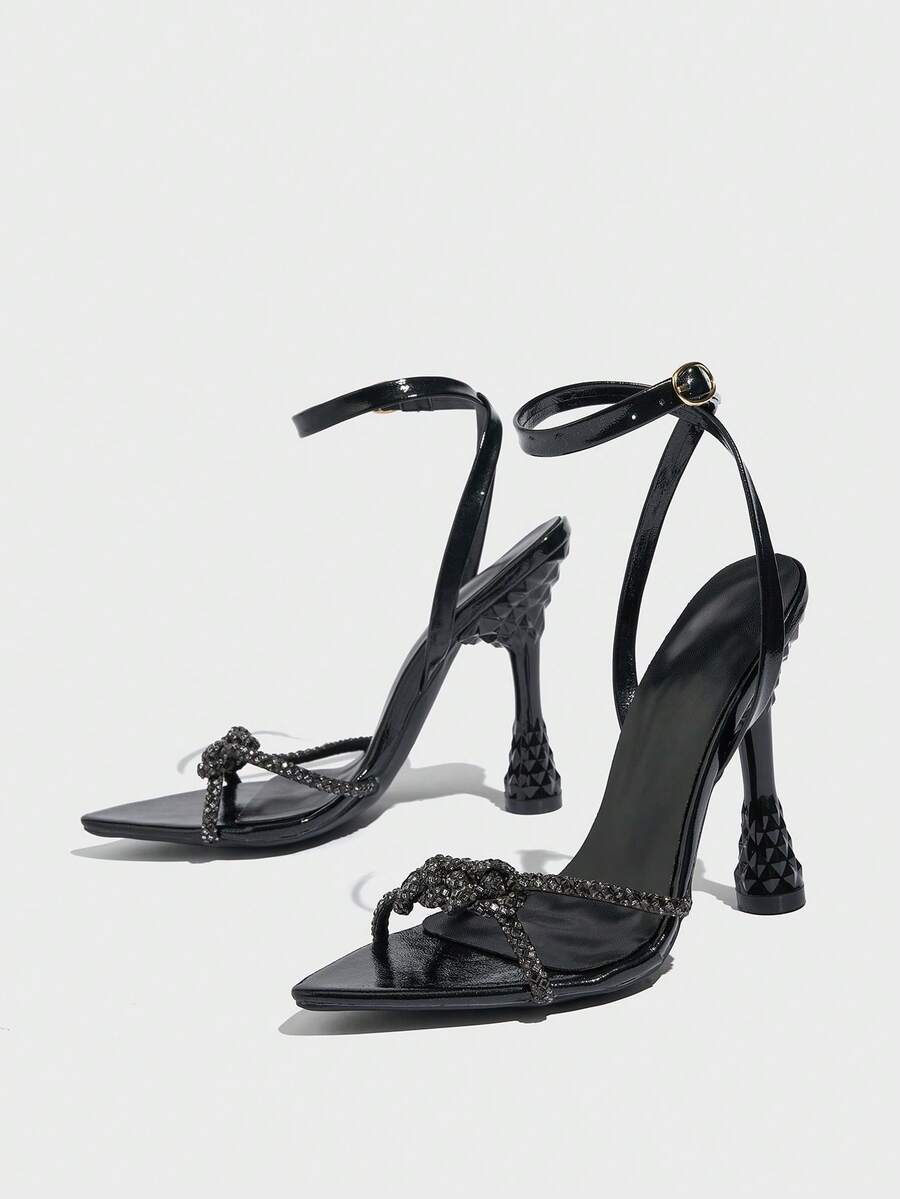 Women's peep toe stiletto high heel strappy sandals with rhinestone accents and slip-on design.