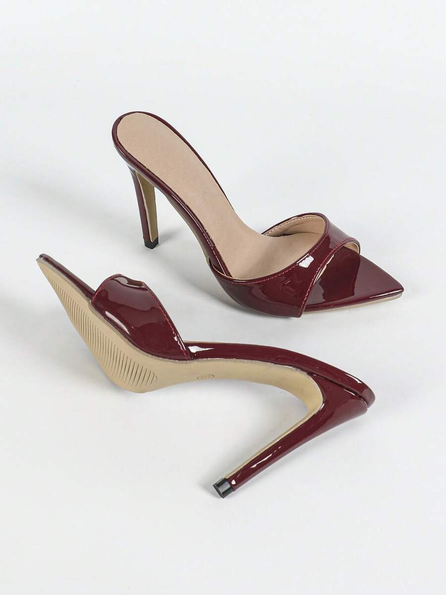Women's open toe stiletto heel slip-on mule sandals with glossy patent leather finish and hollow-out detailing.