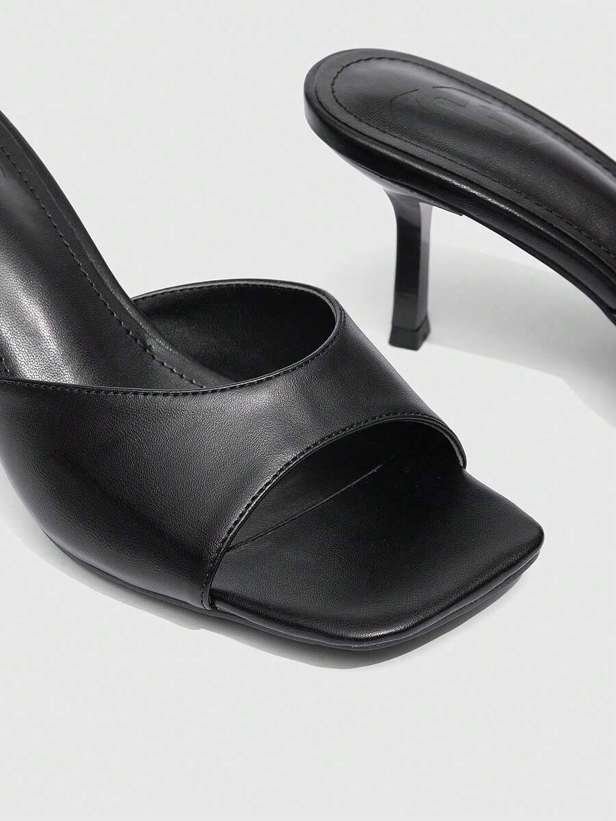 Women's black square toe high heel sandals featuring an open toe design, thin stiletto heel, and slingback strap.