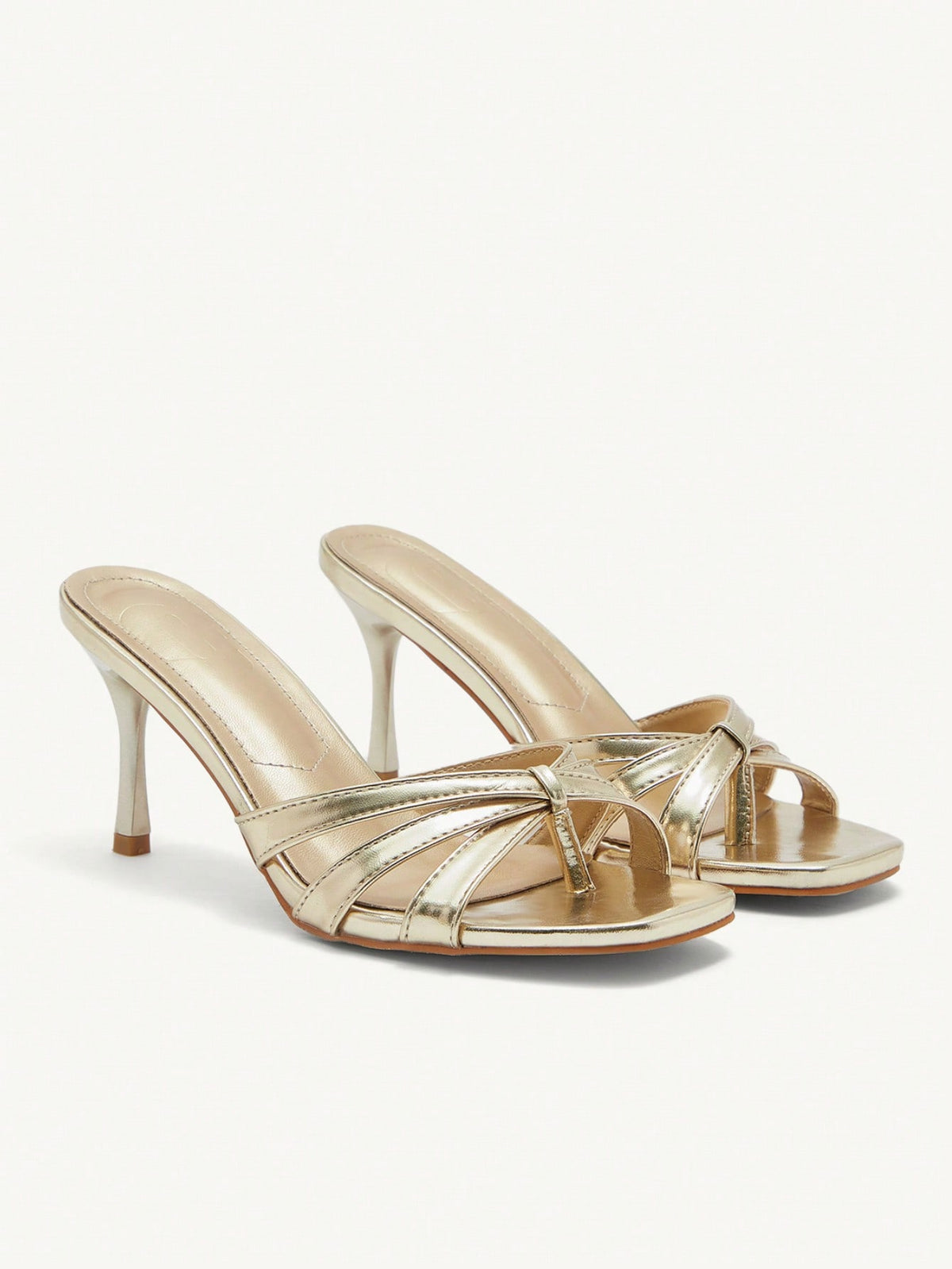 Square toe gold metallic heel sandals for women featuring open toe, crossover slingback strap, and stiletto mid heel for weddings and parties.