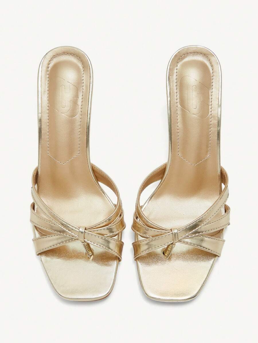 Square toe gold metallic heel sandals for women featuring open toe, crossover slingback strap, and stiletto mid heel for weddings and parties.
