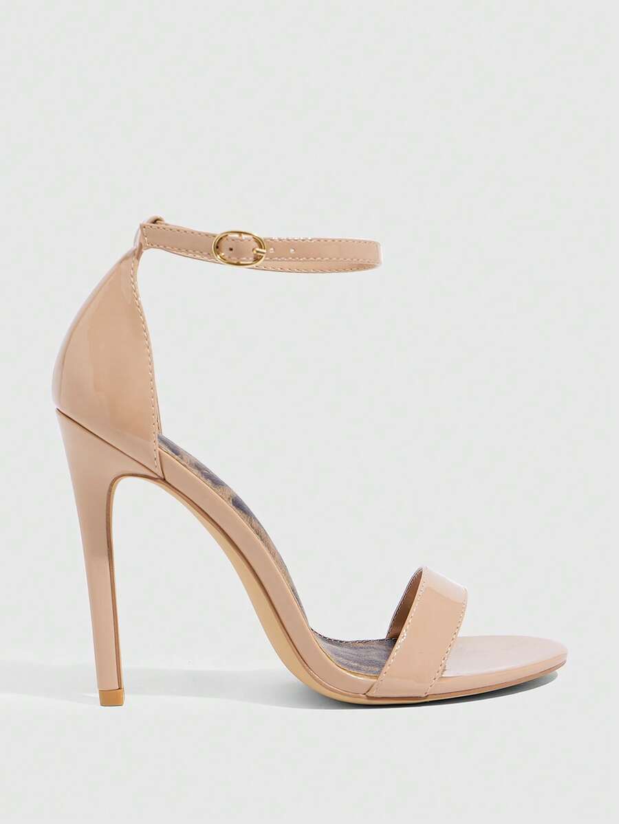 Women's stiletto sandals featuring an ankle strap buckle closure and classic round open toe design.